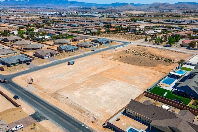 drone / aerial view featuring a mountain view