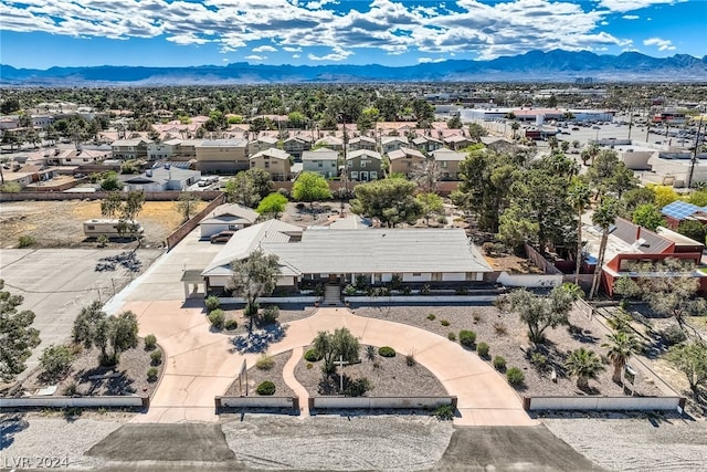 birds eye view of property featuring a mountain view