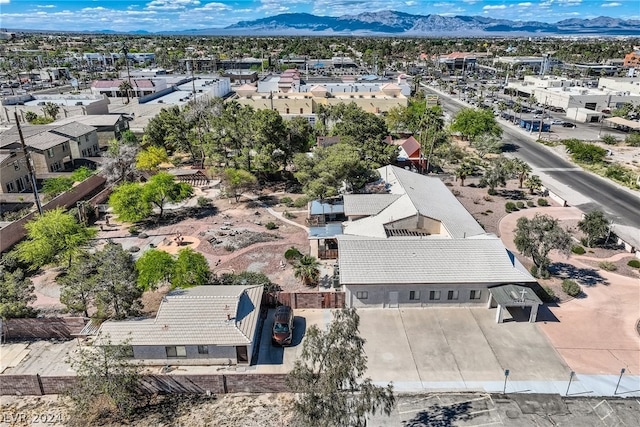 birds eye view of property featuring a mountain view