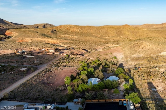 birds eye view of property with a mountain view