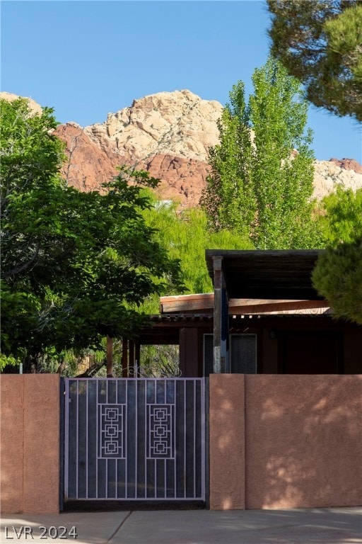 view of gate featuring a mountain view