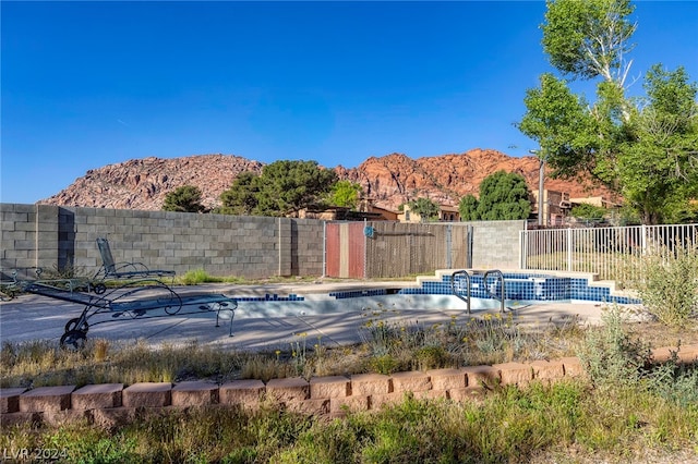 view of pool with a mountain view