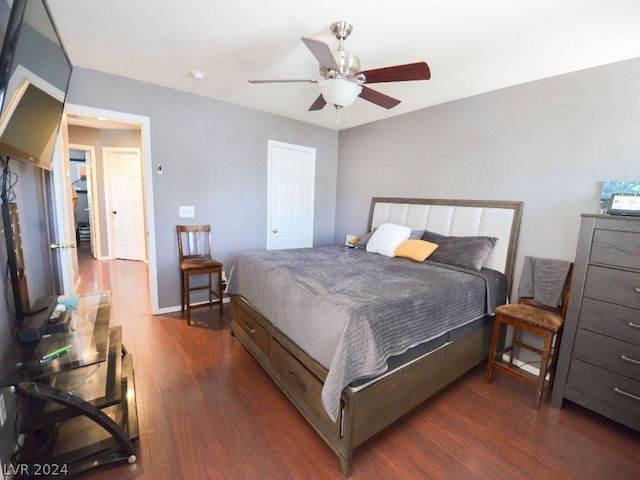 bedroom featuring dark hardwood / wood-style flooring and ceiling fan