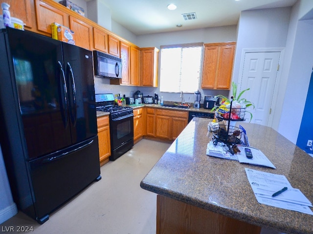 kitchen featuring black appliances and sink