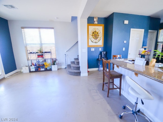 office area with concrete floors