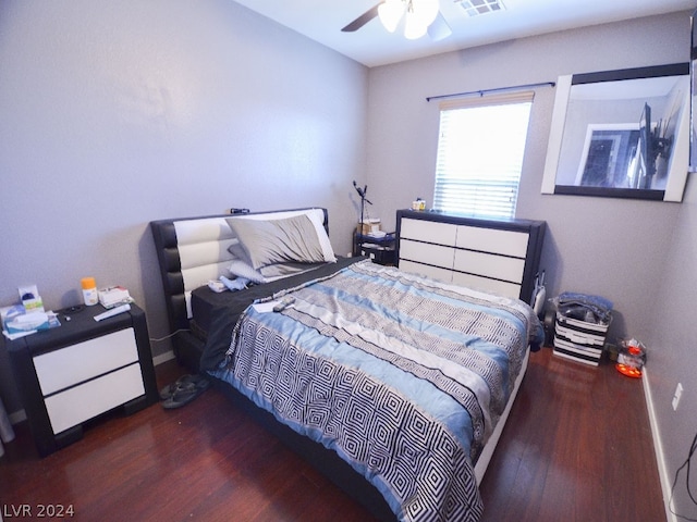 bedroom featuring dark hardwood / wood-style floors and ceiling fan