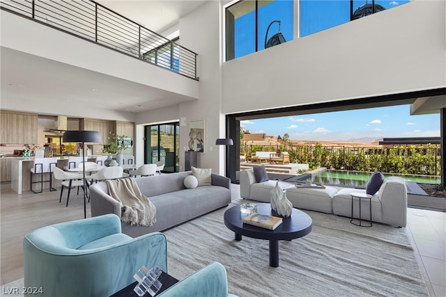 tiled living room with a towering ceiling