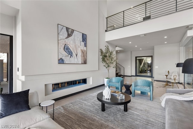 living room with a towering ceiling