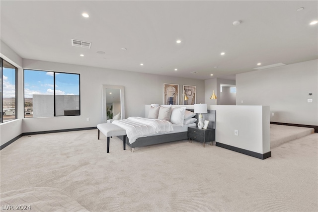 bedroom with light colored carpet