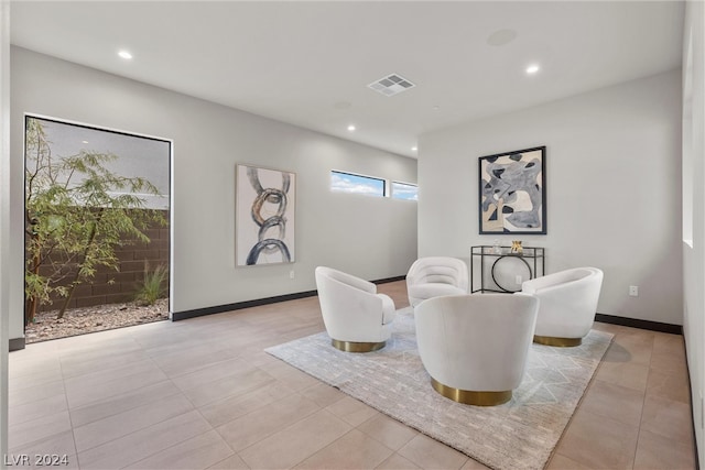 sitting room with light tile patterned floors