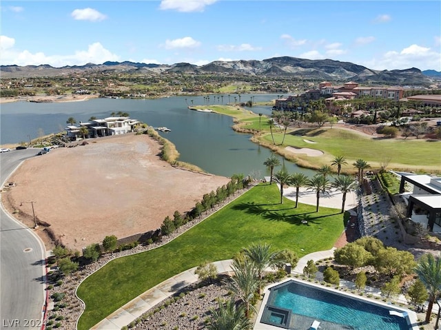 bird's eye view with a water and mountain view