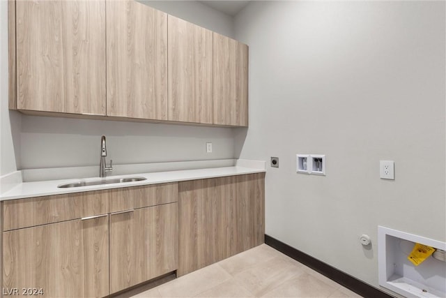 washroom with electric dryer hookup, cabinets, hookup for a gas dryer, sink, and hookup for a washing machine