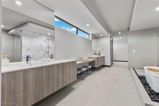 bathroom featuring vanity, walk in shower, and tile walls