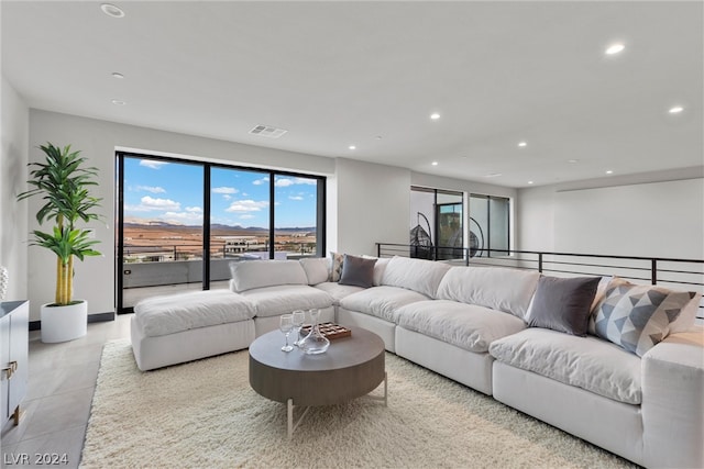 living room with light tile patterned floors