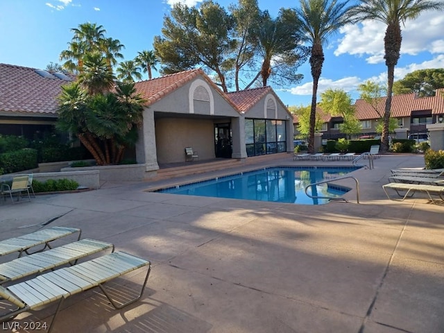 view of swimming pool with a patio