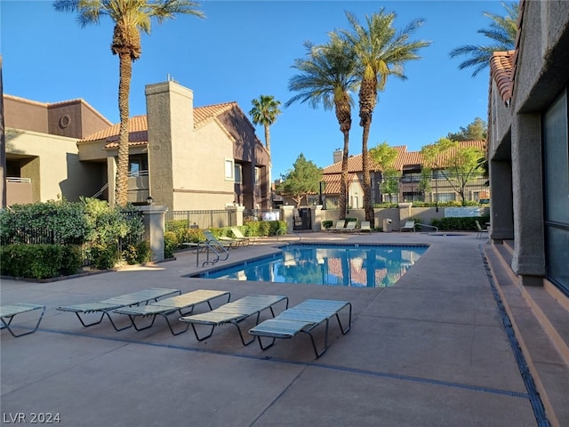 view of swimming pool with a patio