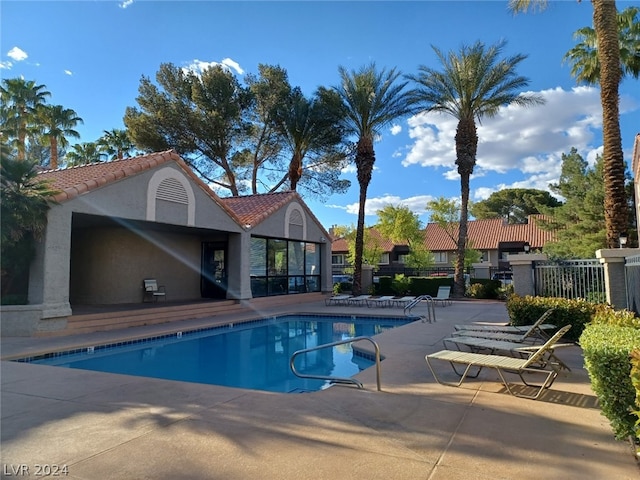 view of swimming pool with a patio