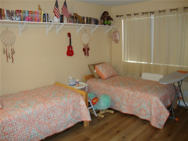 bedroom featuring hardwood / wood-style flooring