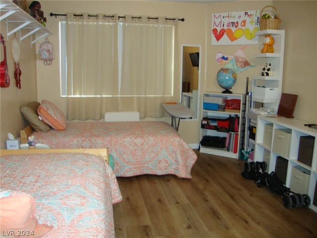 bedroom featuring hardwood / wood-style flooring