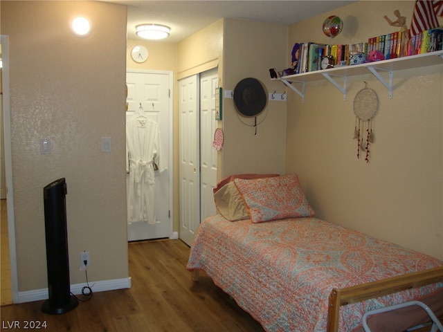 bedroom featuring a closet and hardwood / wood-style floors