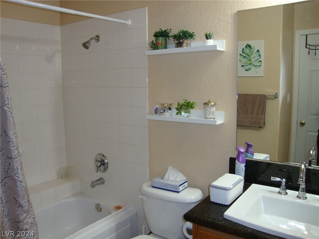 full bathroom with shower / tub combo, vanity, and toilet