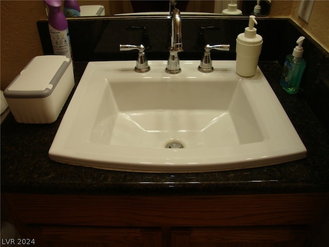 details featuring sink and toilet