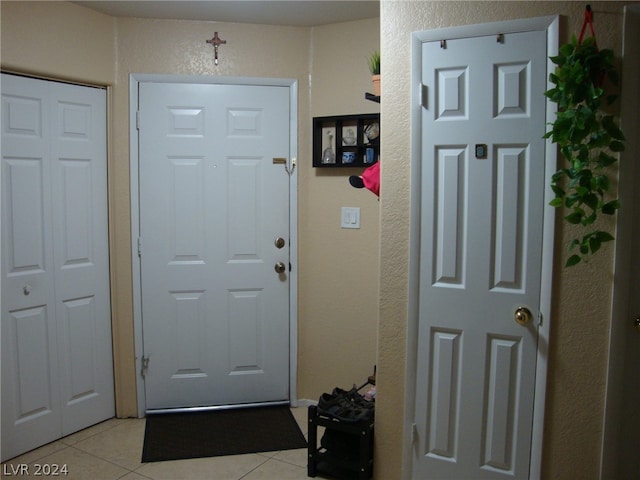 foyer entrance featuring light tile flooring