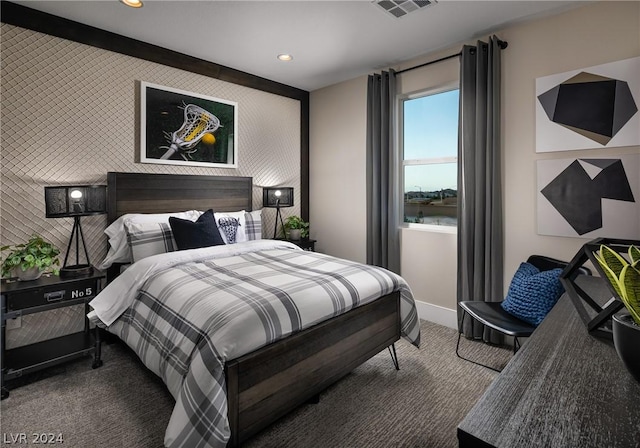 bedroom with carpet and a water view