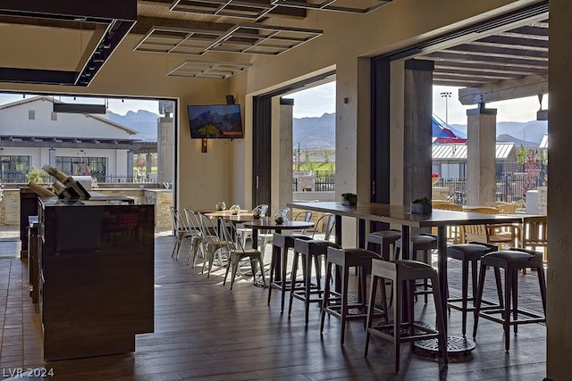 dining space with dark wood-type flooring