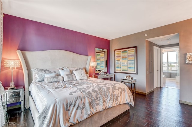 bedroom with dark hardwood / wood-style floors