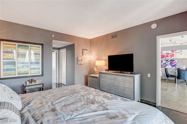 bedroom featuring wood-type flooring