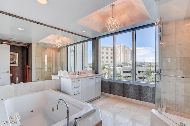 bathroom featuring independent shower and bath, a notable chandelier, vanity, and tile patterned flooring