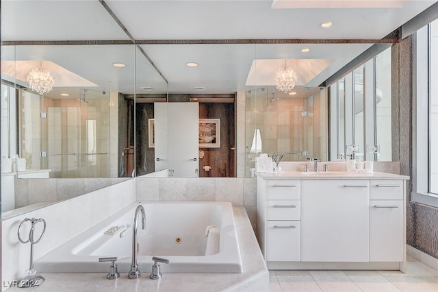 bathroom featuring a notable chandelier, tile patterned floors, independent shower and bath, and vanity