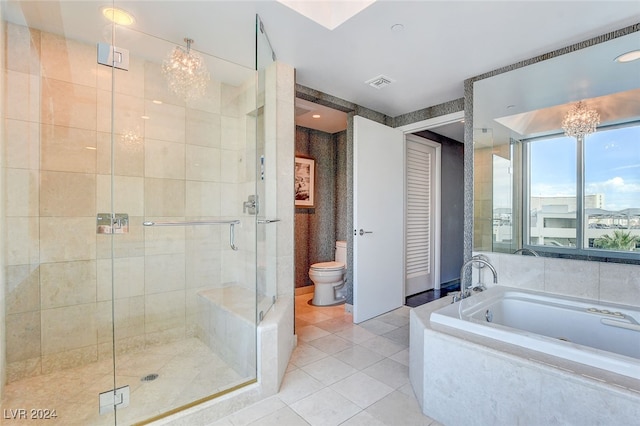 bathroom with a chandelier, separate shower and tub, tile patterned floors, and toilet