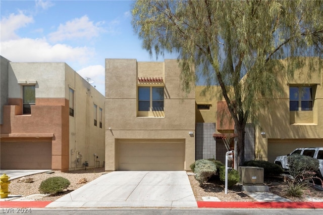 southwest-style home with a garage