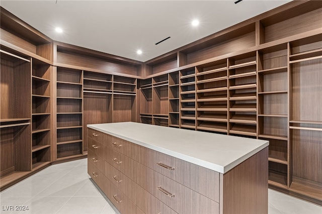 spacious closet featuring light tile patterned floors