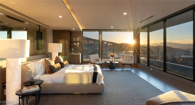 bedroom with a mountain view and expansive windows