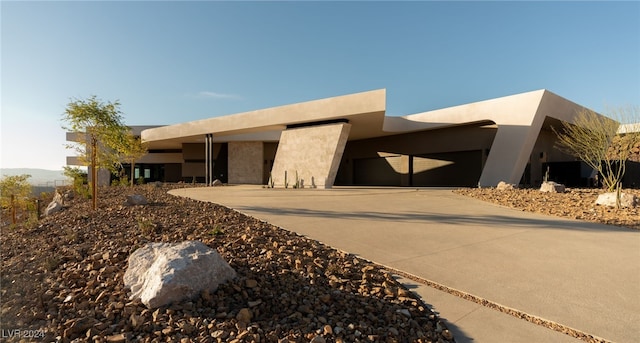 southwest-style home with a garage