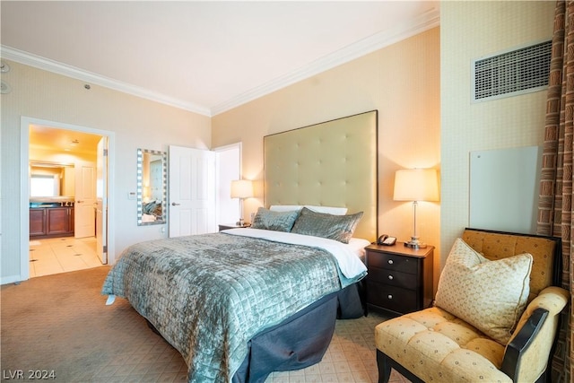 bedroom featuring ensuite bathroom and crown molding