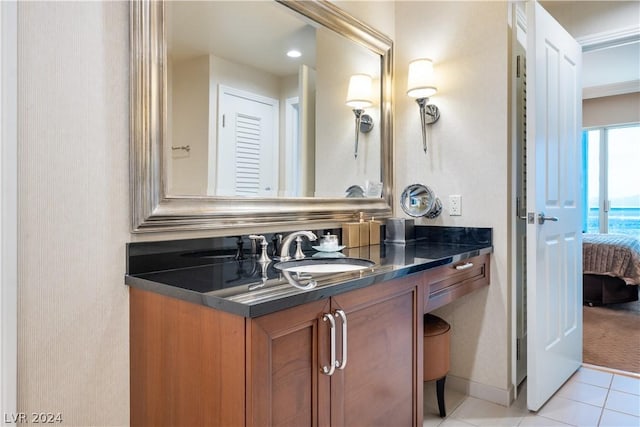 bathroom with tile patterned floors and vanity