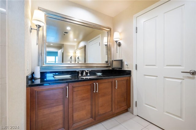 bathroom with vanity and tile patterned flooring