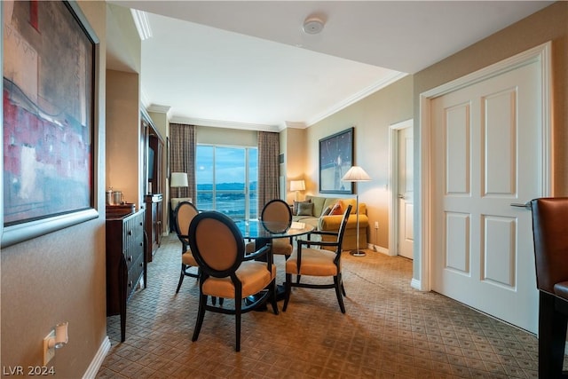 dining area featuring crown molding