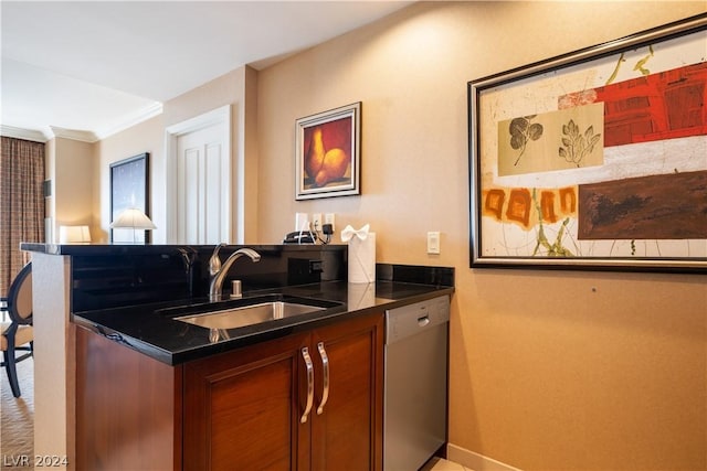 kitchen featuring dishwasher, ornamental molding, and sink