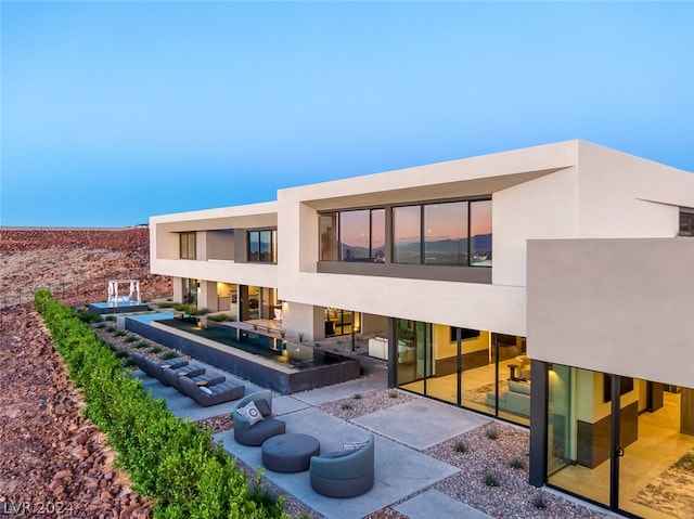 rear view of house with a patio area