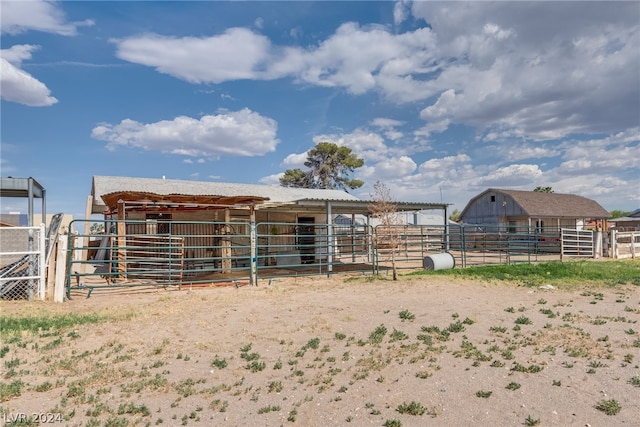 view of outdoor structure with a rural view