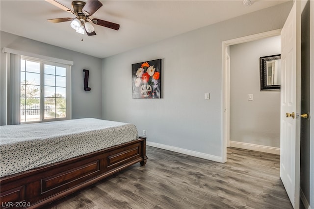 bedroom with ceiling fan and wood-type flooring