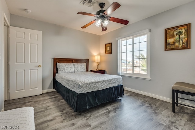 bedroom with hardwood / wood-style floors and ceiling fan