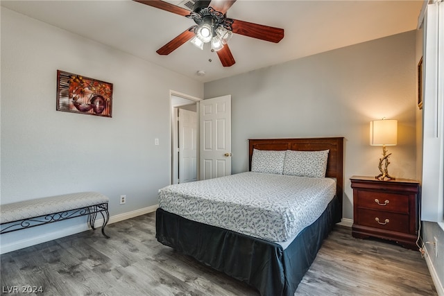 bedroom featuring hardwood / wood-style flooring and ceiling fan