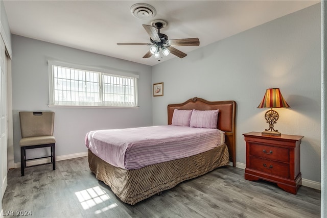 bedroom featuring hardwood / wood-style floors and ceiling fan