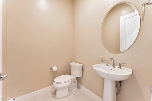 bathroom featuring tile patterned floors and toilet